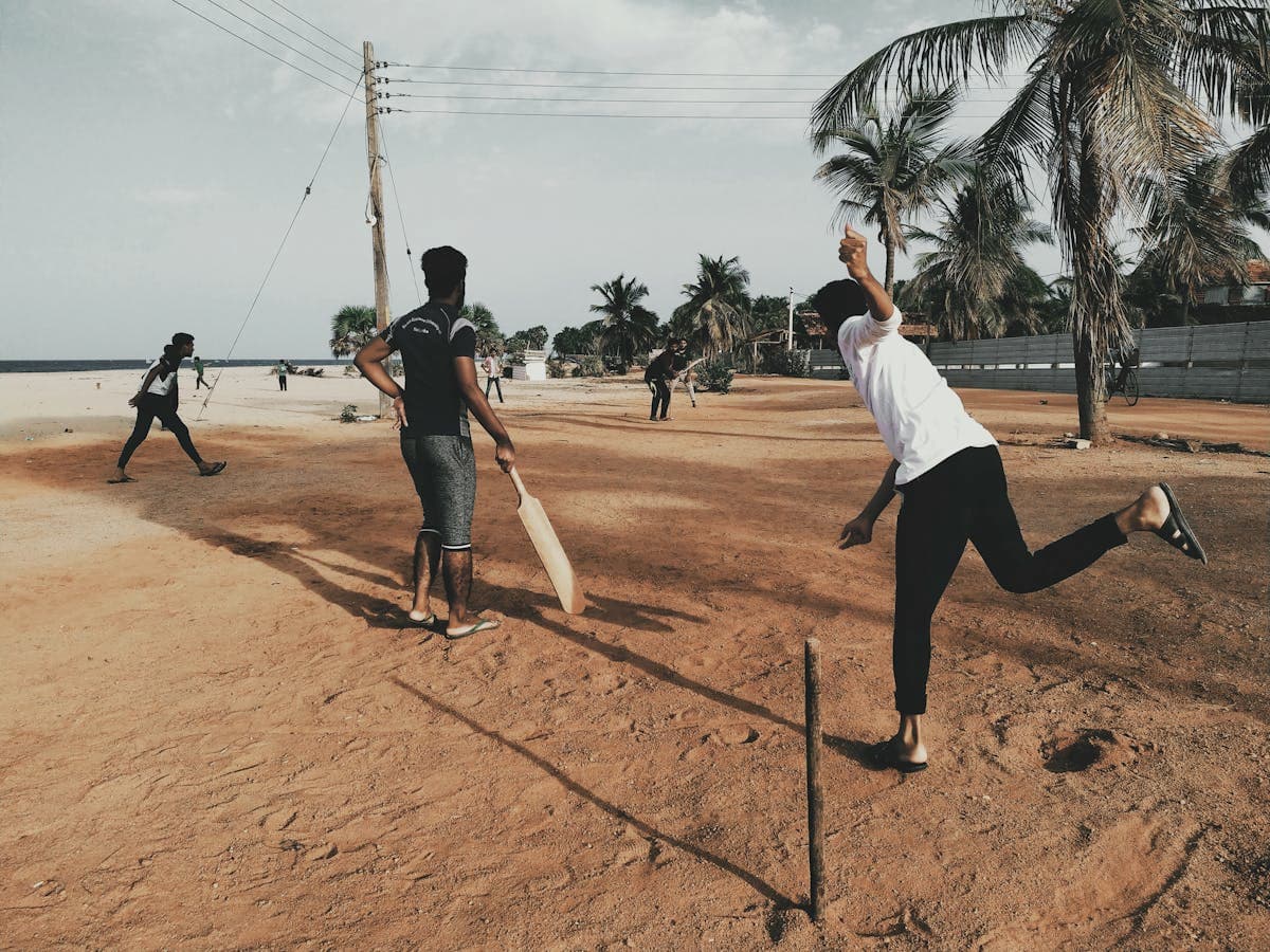 People playing casual beacgh games like volleyball and frisbee along the sandy shores of goa, enjoying the sea breeze and sunshine