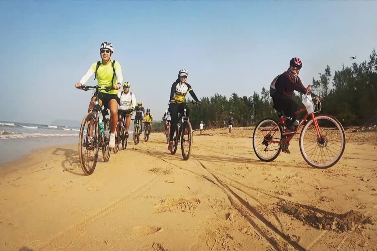 Group of travellers on a guided cycling tour through Goa's scenic trails, combining adventure with a fun-filled treasure hunt challenge