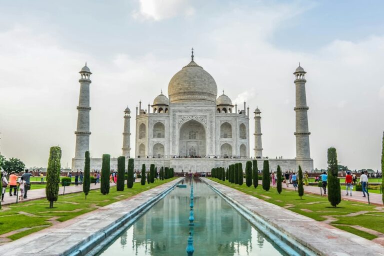Taj Mahal front view in soft sunlight with marble dome and minarets