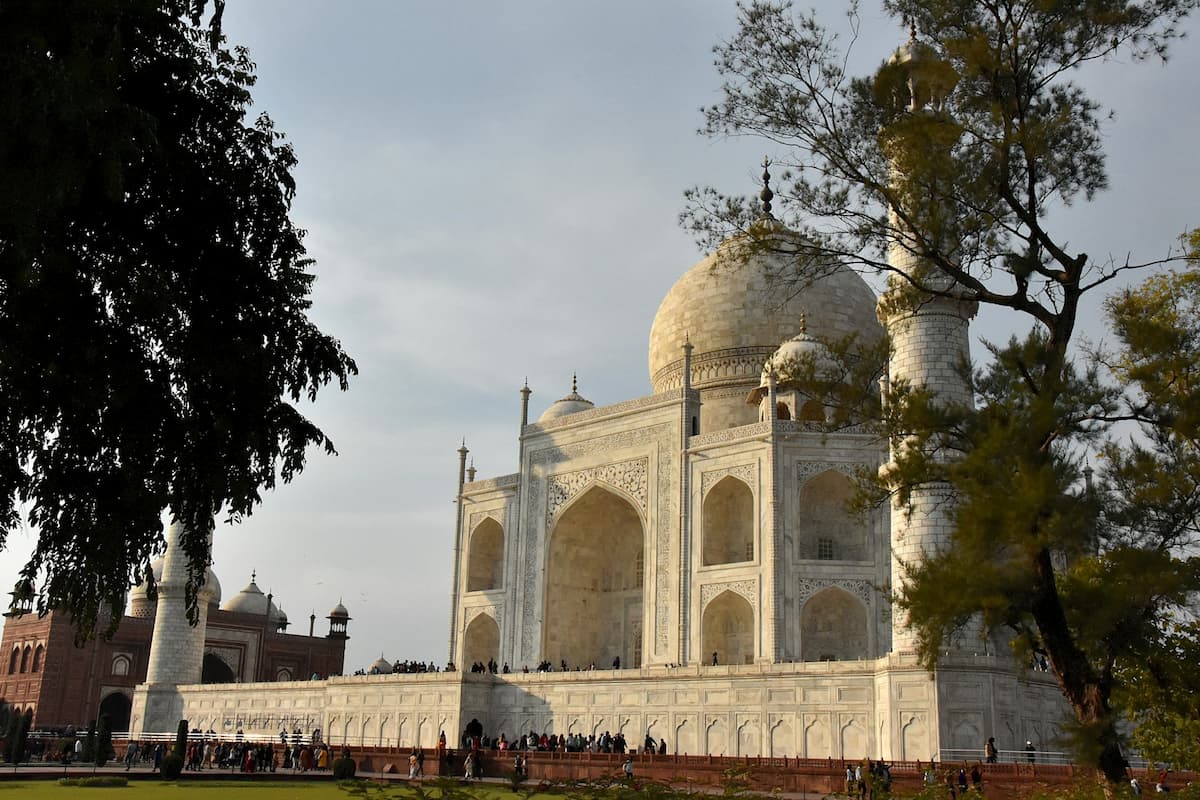 Symmetrical view of the Taj Mahal with reflection in the pool, representing architectural symbolism